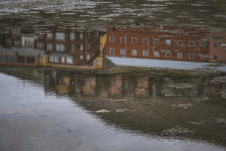 an industrial canal reflects its reflections in the water