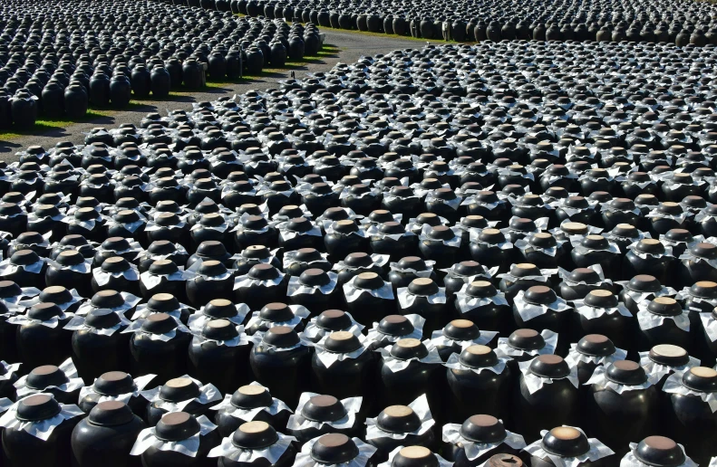 rows of old fashioned kettles all lined up