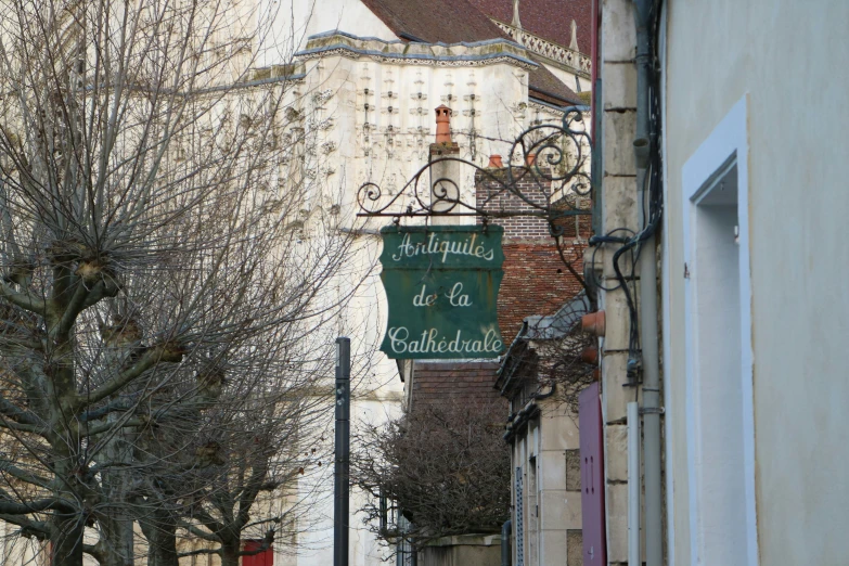 a street corner sign sitting next to a building