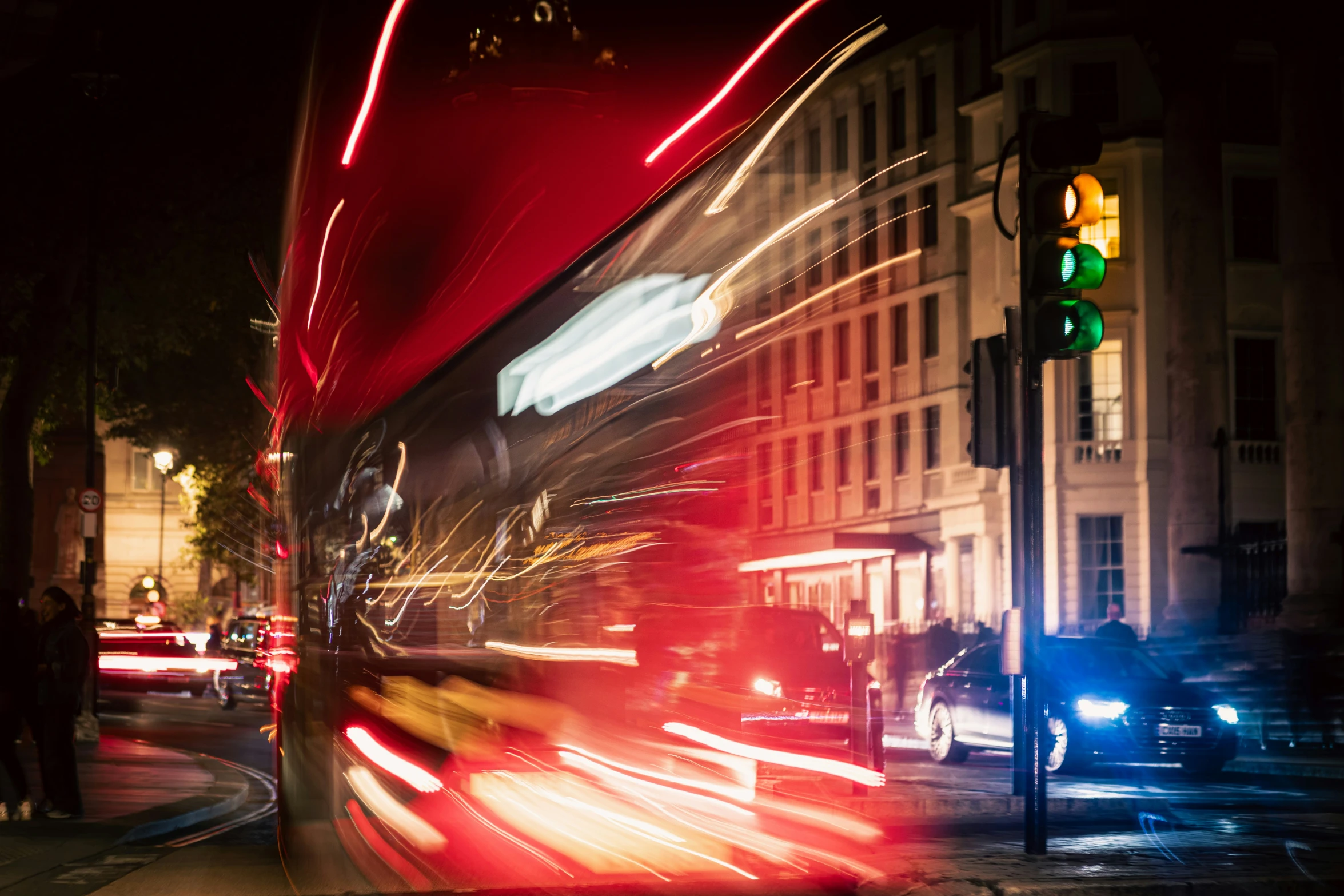 a city street with traffic lights and a bus