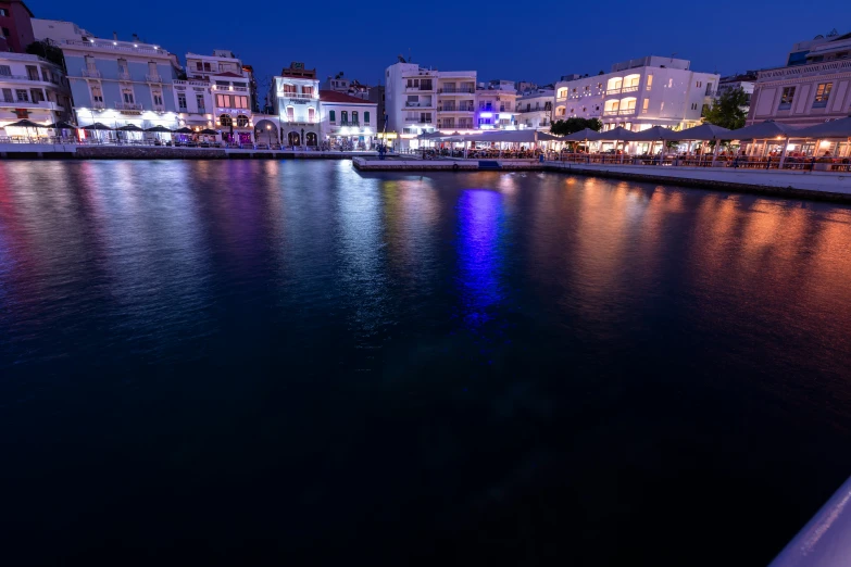 cityscape at night from the water's edge