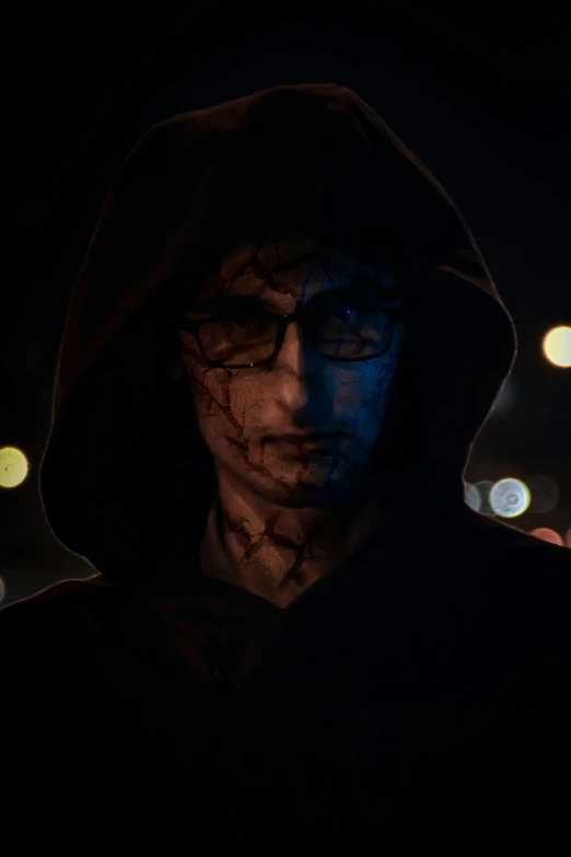 a guy standing in the street is covered in blue light