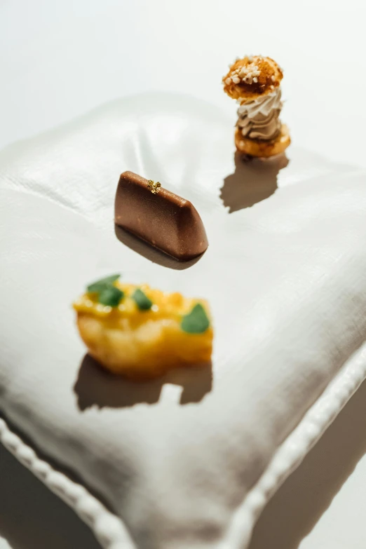 a table with small cakes and pastries on it