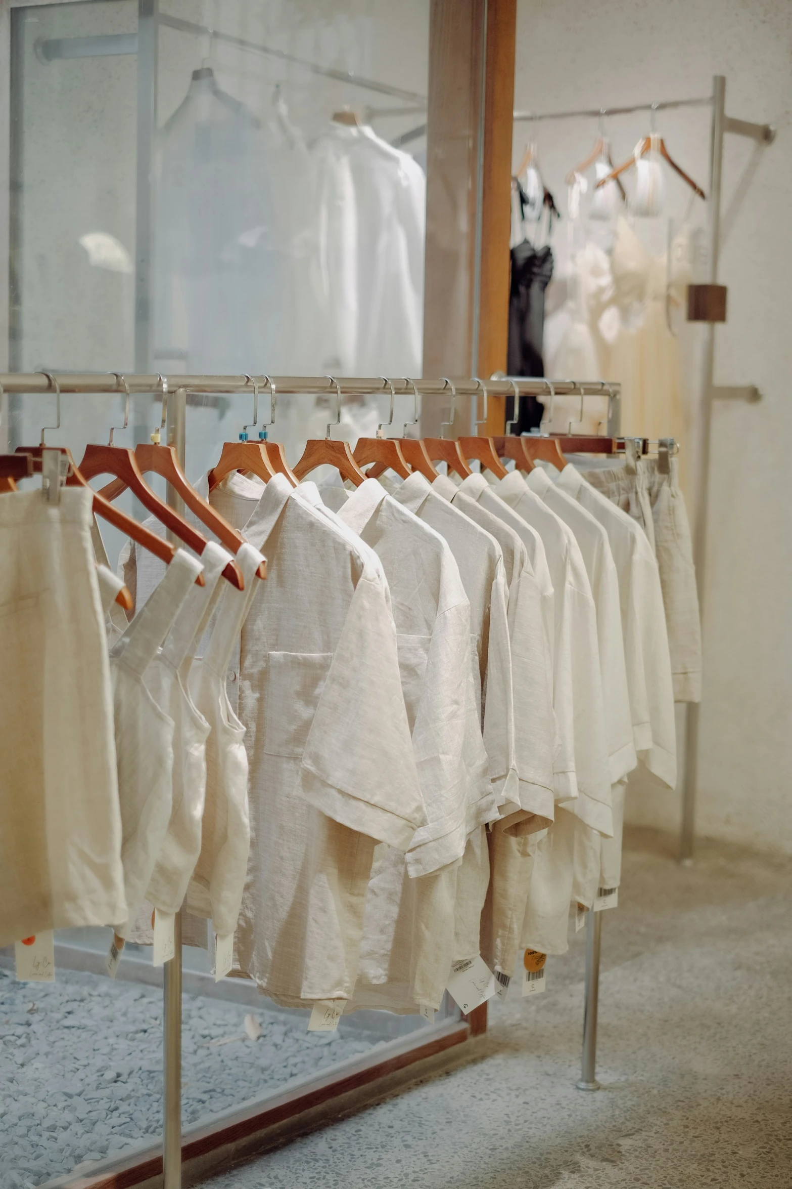 a rack with some clothes hanging and other clothing