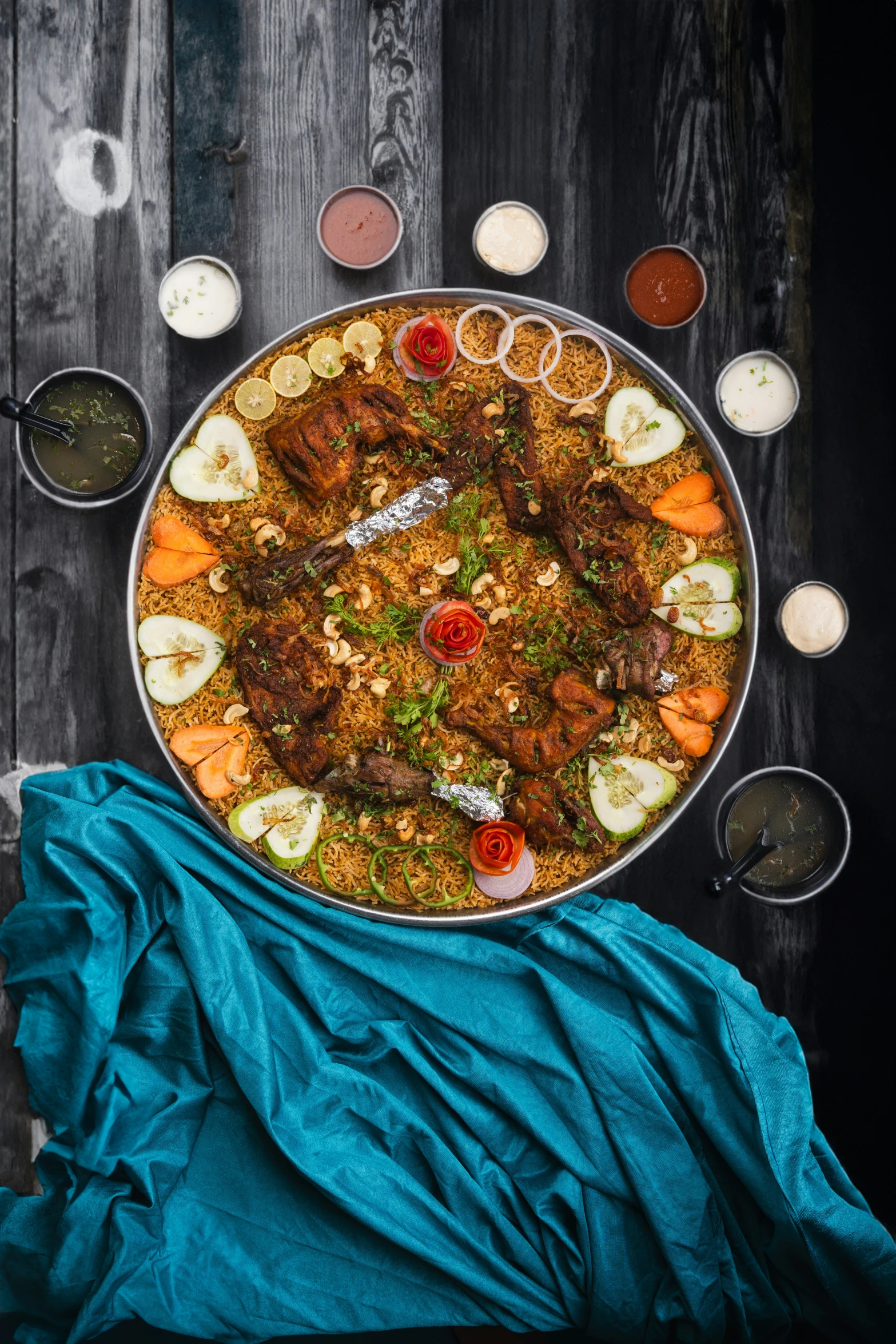 a dish of food is in a bowl next to various drinks