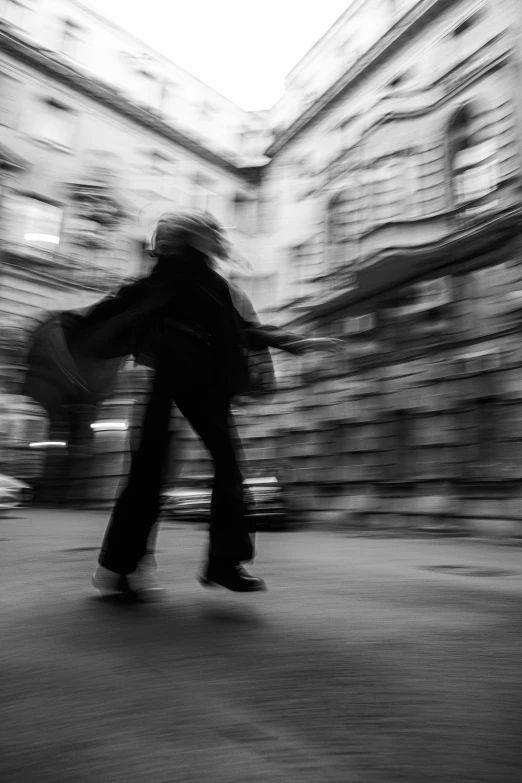 a blurred image of a person on a skateboard