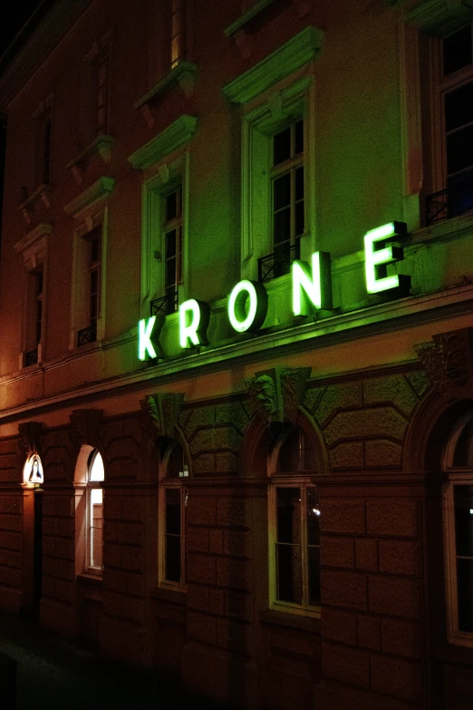 a light on a building that reads krone