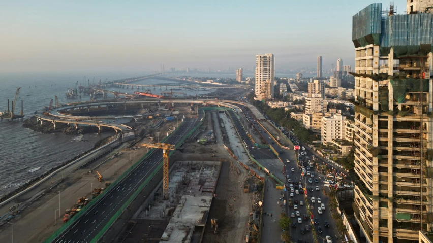 a city with lots of tall buildings next to a street