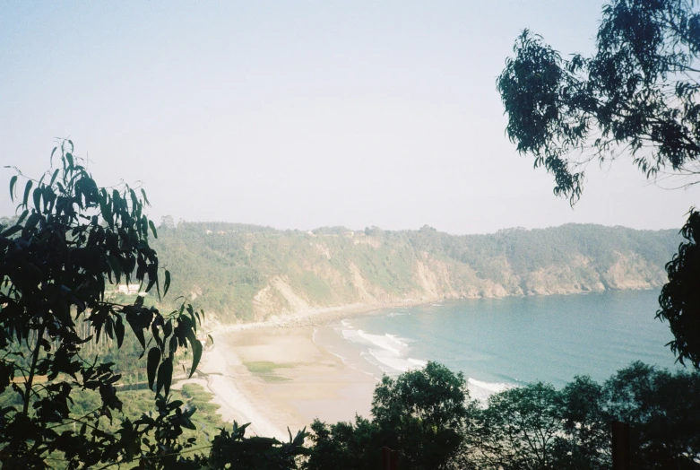 looking over to a beach and a steep cliff