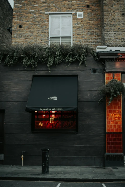 some red signs and windows on the side of a building