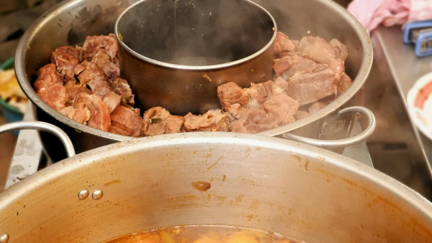 a saucepan that has soing in it sitting on a table