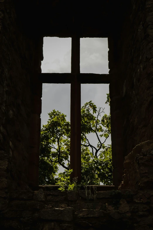 a clock tower through an open window with the view