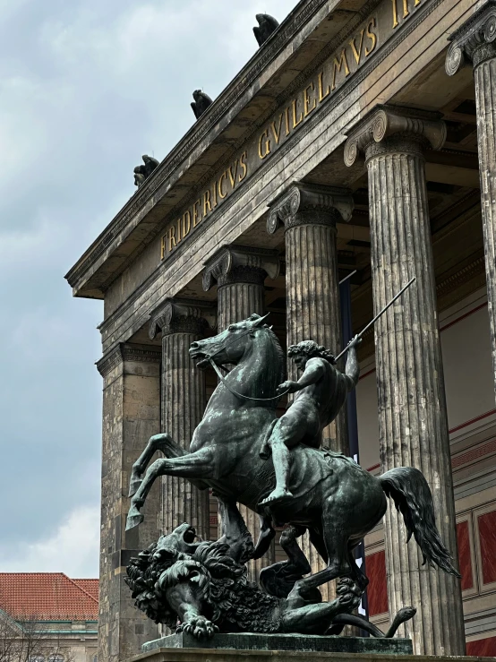 a statue of two horses is shown on display