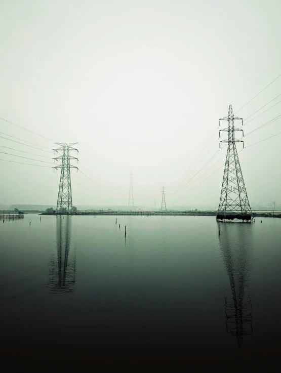 a body of water with power lines on it