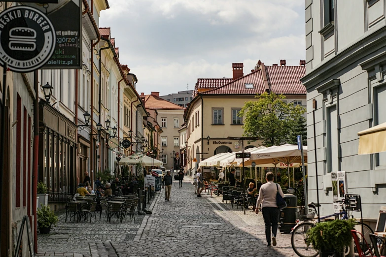 this is an old european town with people walking down the street