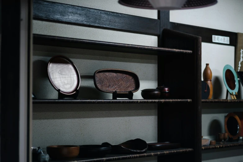 decorative wooden shelves are displayed on a wall