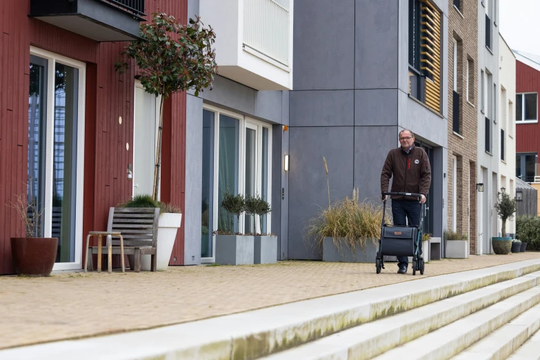 a man is pulling a bag on the back of a chair