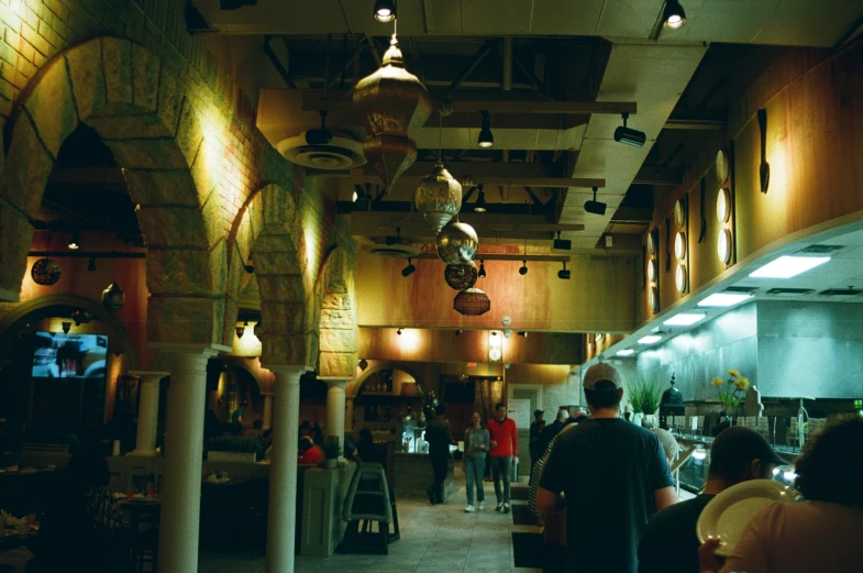 an empty restaurant with a bunch of people eating