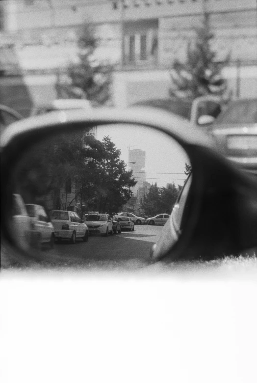 a view through the side mirror of a car