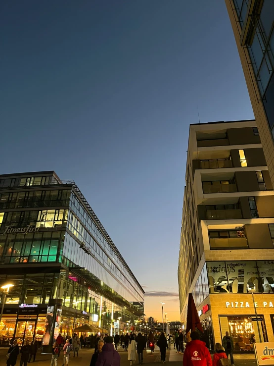 a couple of buildings in the city at dusk