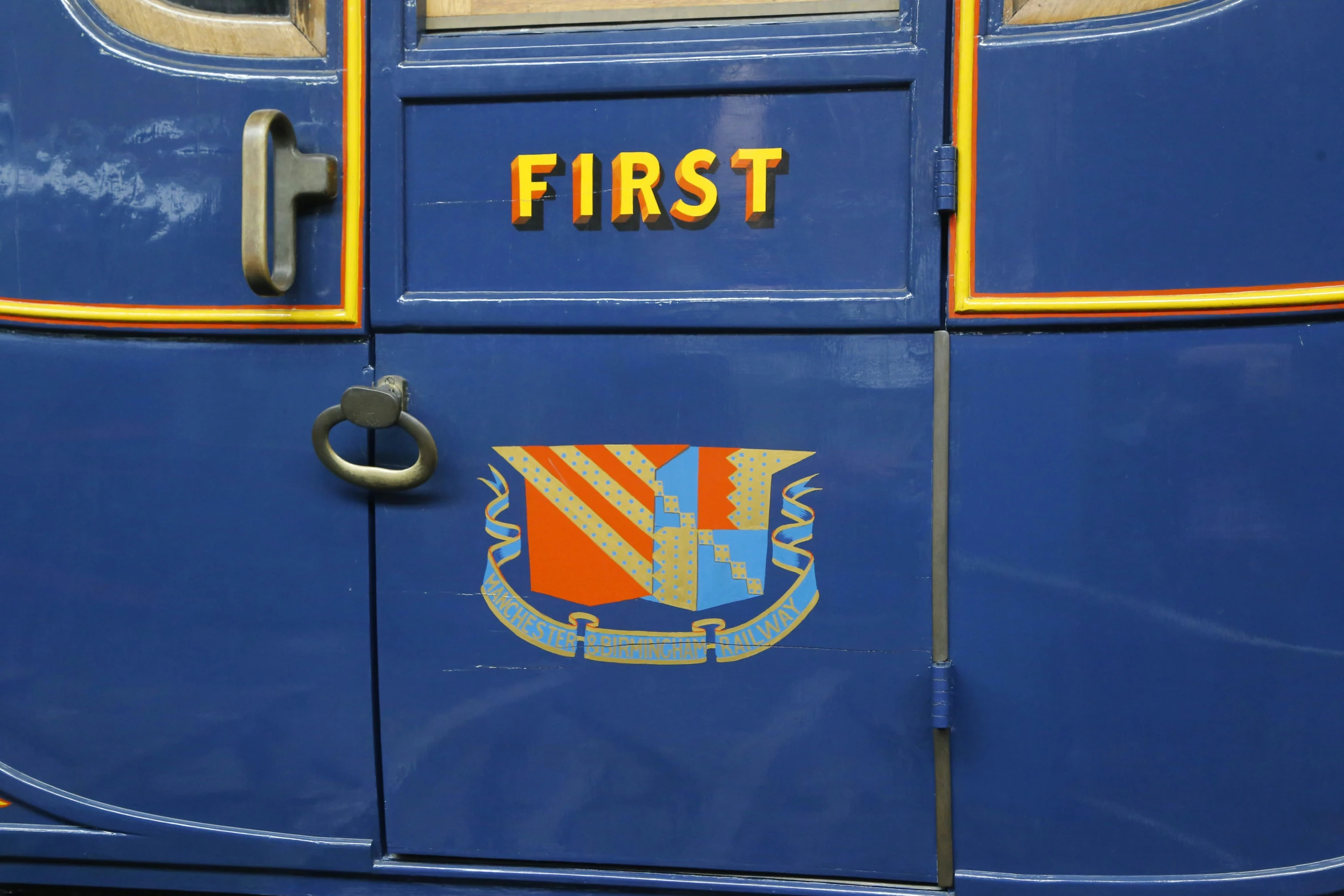 a blue van with first logo on the door