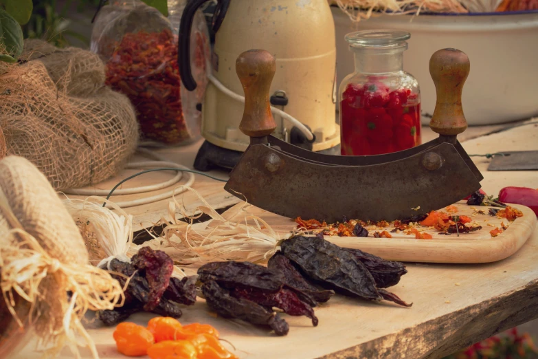 some food is laid out on the counter near a butcher's knife