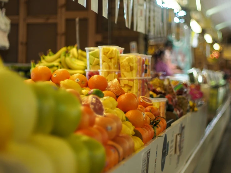 an assortment of fruit is displayed in a market