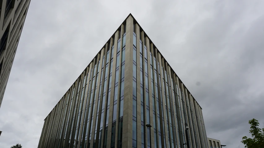 a tall building with lots of windows near by