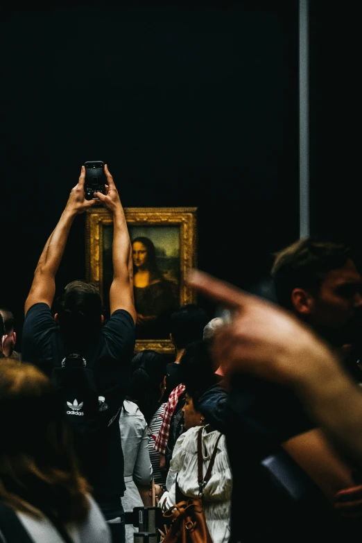 people are taking pictures of a portrait