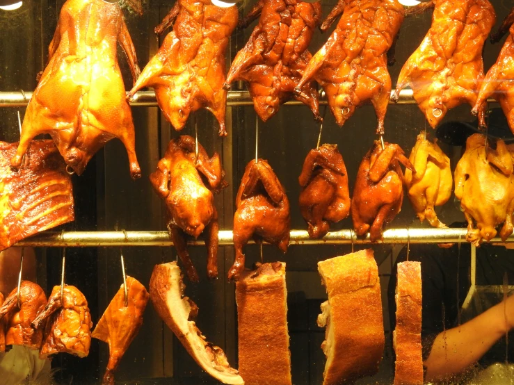 barbecue meats and ribs are being prepared on racks