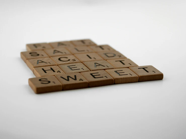 scrabble tile that has a square and a smaller one on it