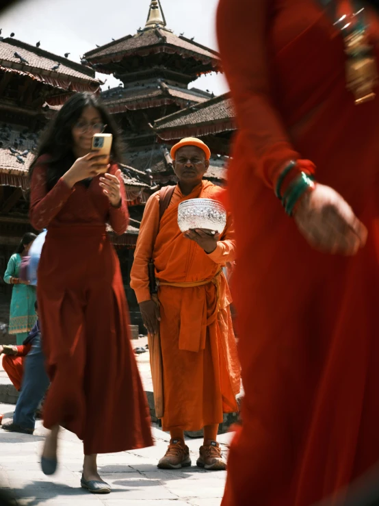 a group of people with different colored dress