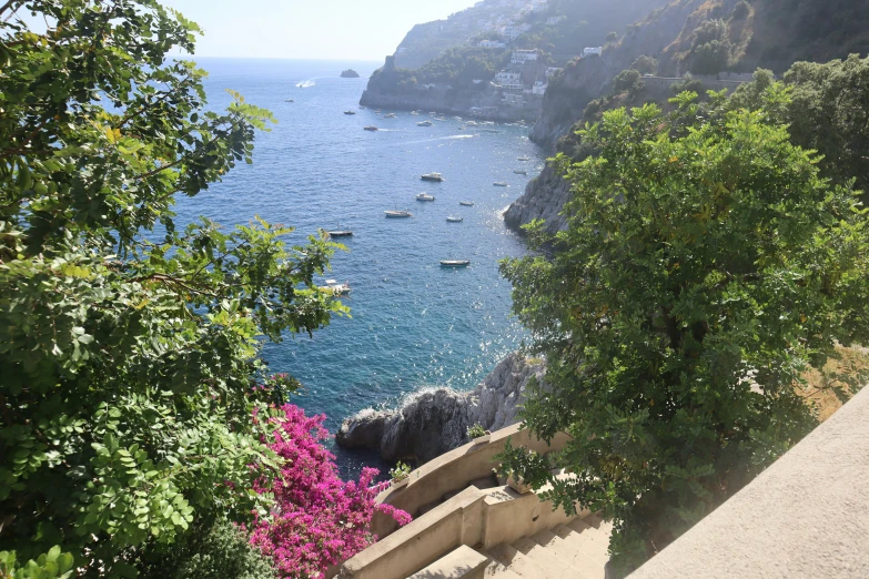 a scenic view of water and boats on the ocean