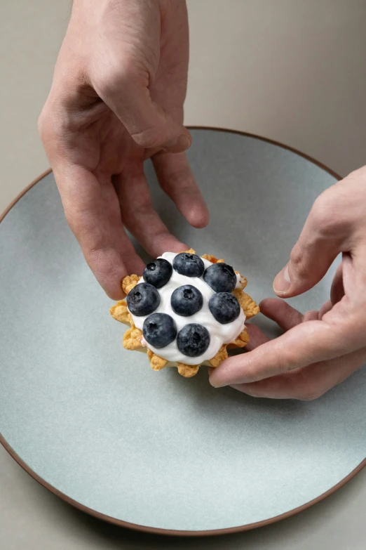 the person is about to make a dessert on the plate