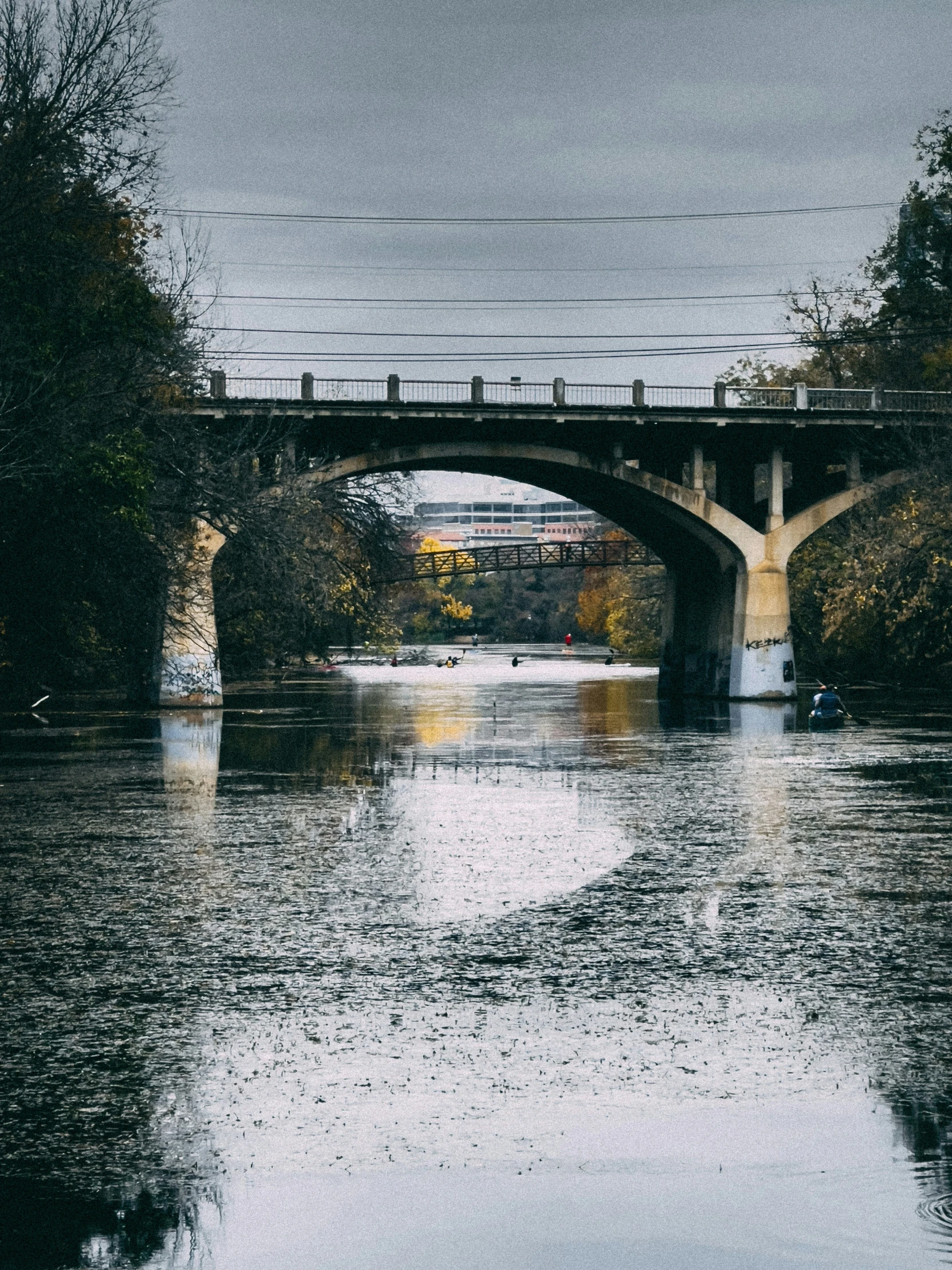 a large body of water that has a bridge over it