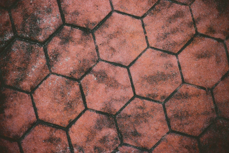 a closeup view of red grungy concrete