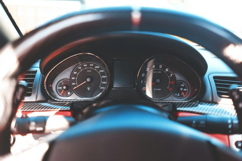 the interior of a car with two gauges