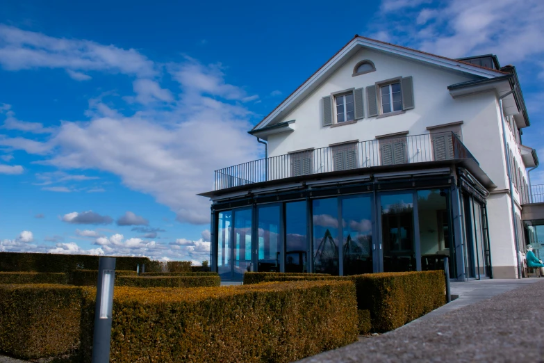 a house and its garden next to a fence