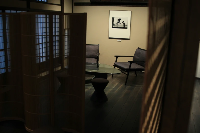 a living room with two chairs and a table