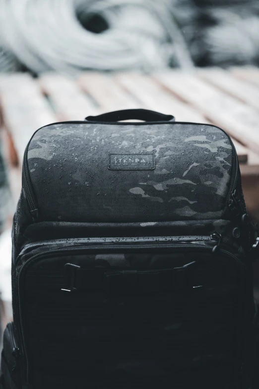 a back view of an old backpack on the floor