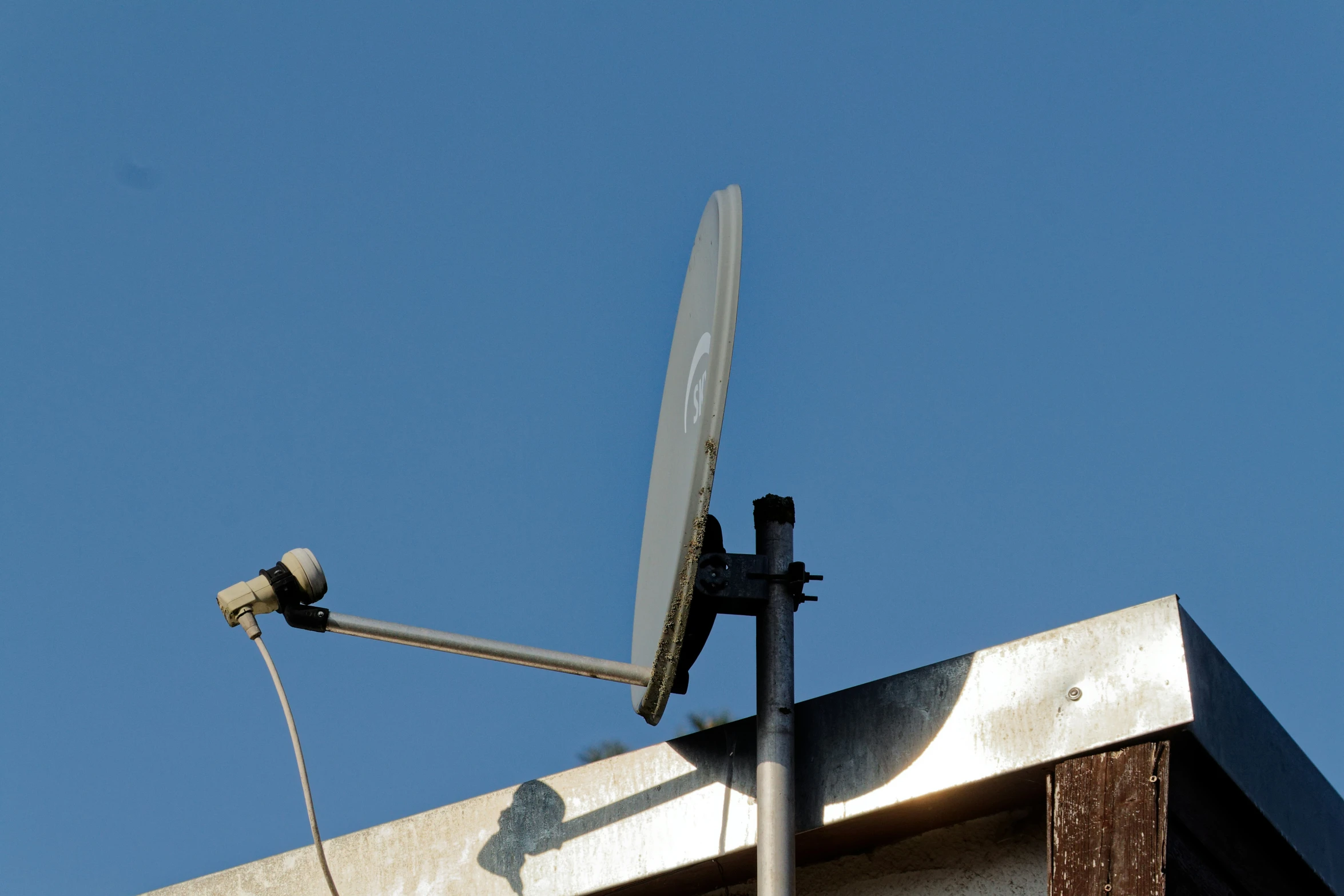 an upside down satellite dish sitting on top of a building