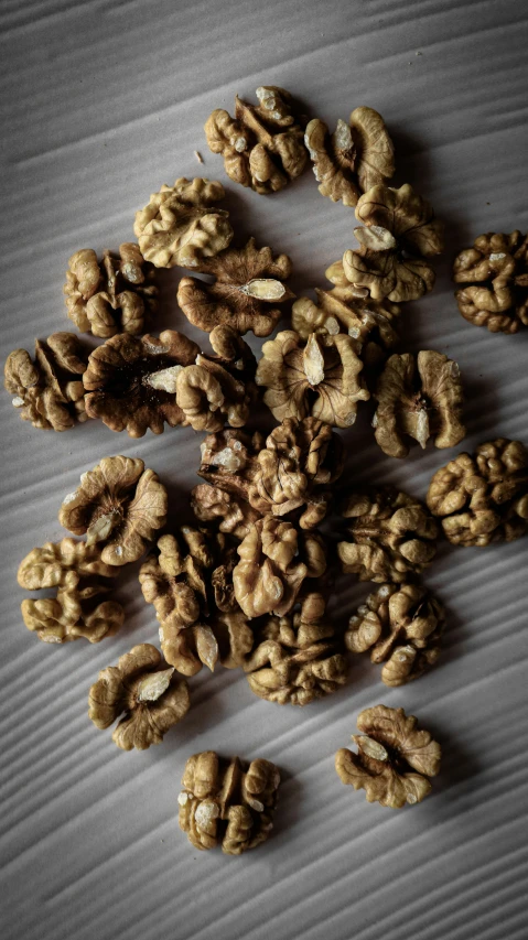 several pieces of walnuts scattered next to each other