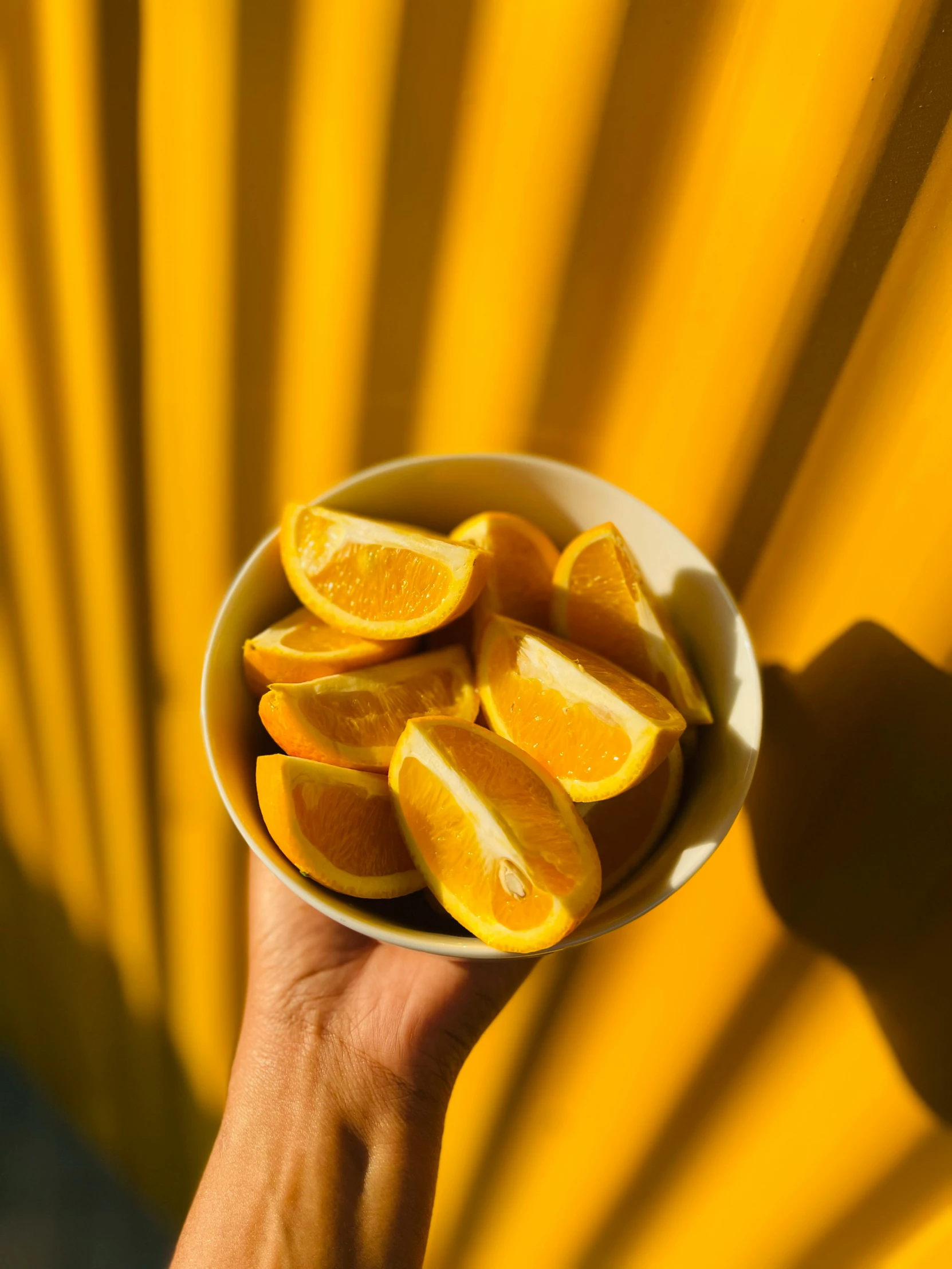 a small bowl that is filled with sliced oranges