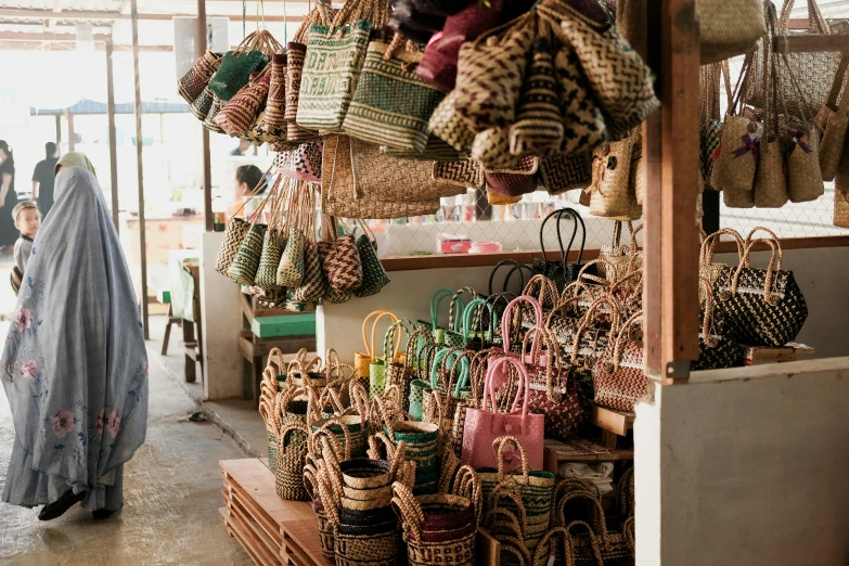 a market with several baskets and people walking by