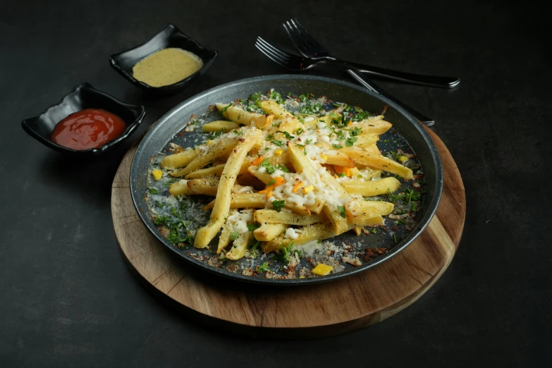 cooked pasta with vegetables and sauces on serving platter