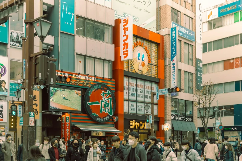 a bunch of people and buildings in the middle of a street