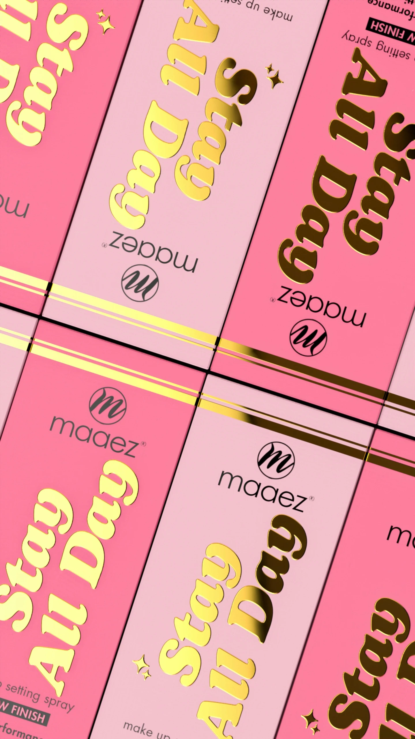 a group of pink boxes with gold foil