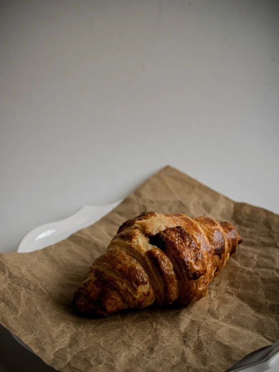 the pastry is laying on a plate and paper