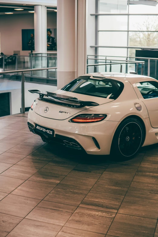 a sports car parked in a showroom