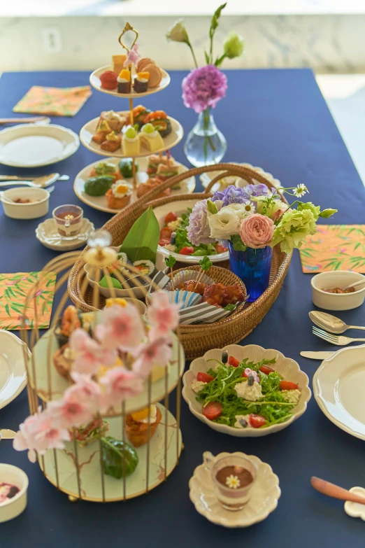 the flowers on the table are in wicker baskets